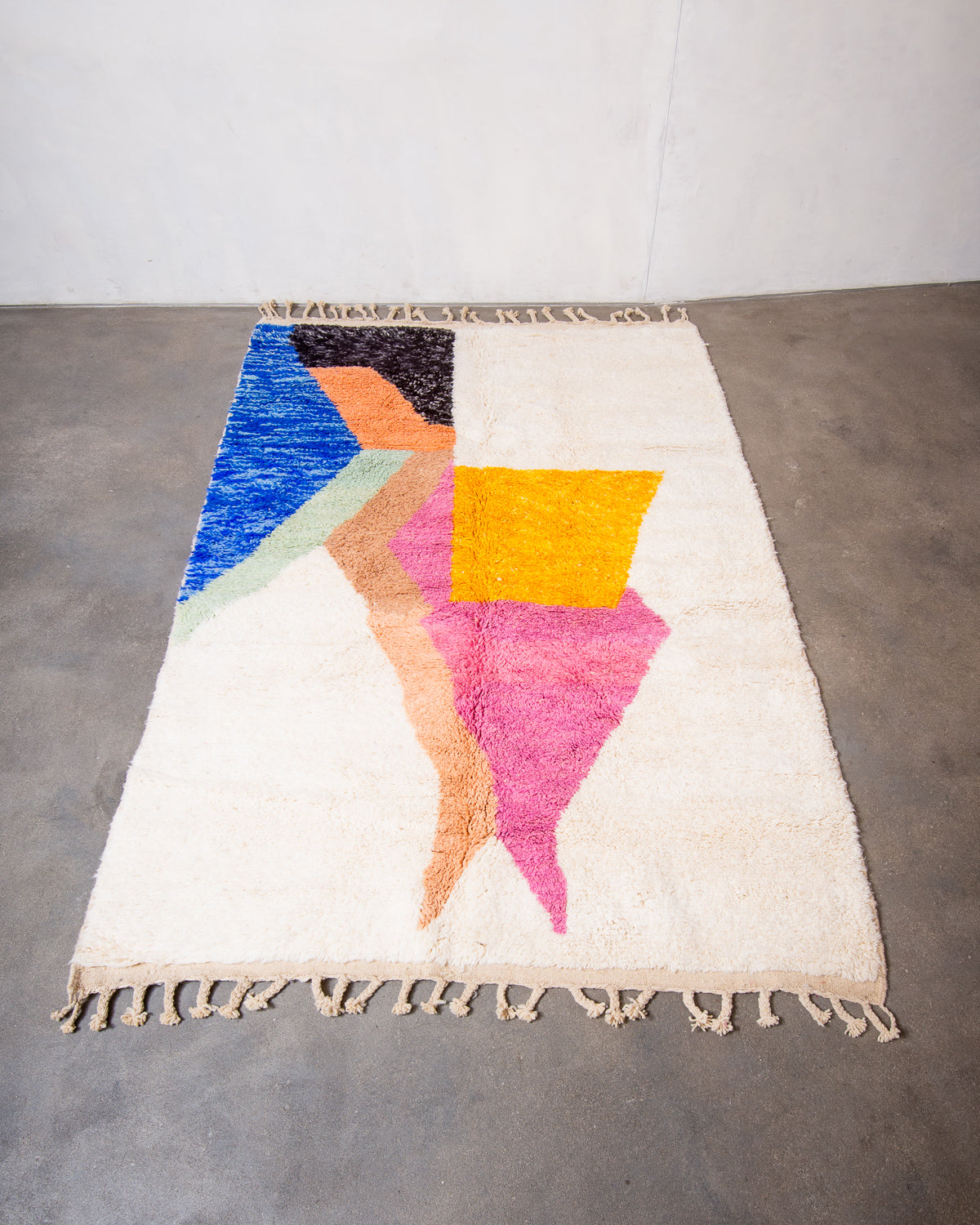 Modern, designer, handcrafted Berber rug from Morocco. Beniourain carpet with beautiful colours and patterns and fluffy wool texture.